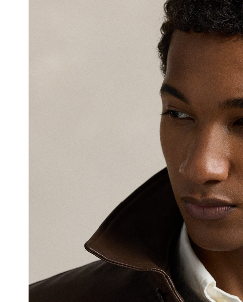 This jacket combines the sporty silhouette of a windbreaker with supple full-grain leather. Plaid lining gives it a heritage-inspired touch.