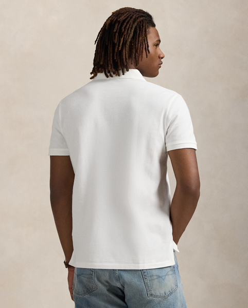 An American style standard since 1972, the Polo shirt has been imitated but never matched. Over the decades, Ralph Lauren Lauren has re-imagined his signature style in a wide array of colours and fits, yet all retain the quality and attention to detail of the iconic original. This trim version is made from our highly breathable cotton mesh, which offers a textured look and a soft feel.