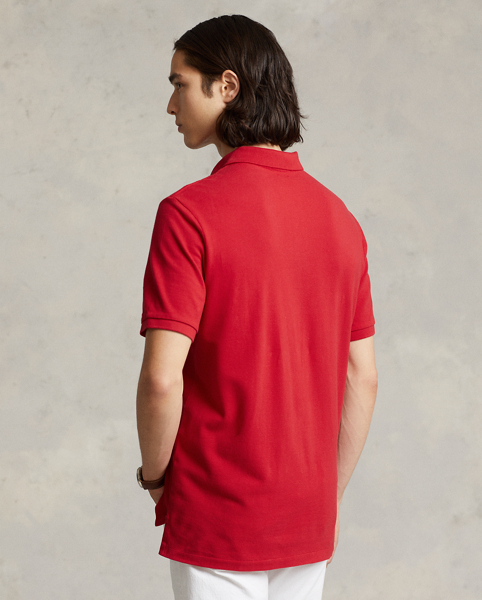 An American style standard since 1972, the Polo shirt has been imitated but never matched. Over the decades, Ralph Lauren Lauren has re-imagined his signature style in a wide array of colours and fits, yet all retain the quality and attention to detail of the iconic original. This trim version is made from our highly breathable cotton mesh, which offers a textured look and a soft feel.