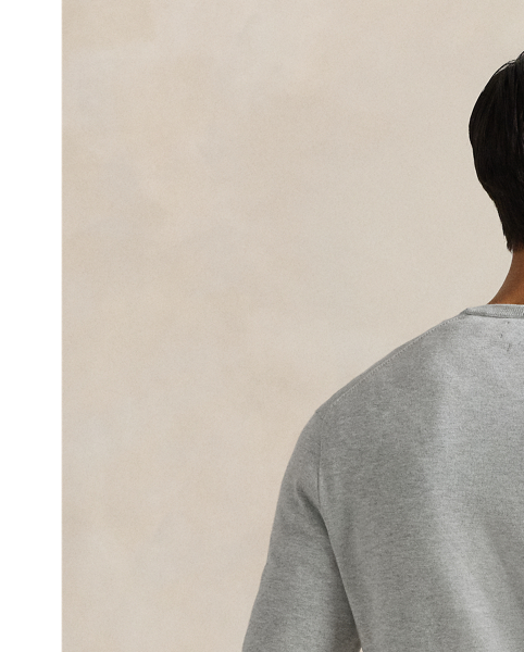 Knit from soft, breathable cotton, this lightweight sweater is a year-round layering piece.