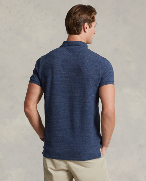 An American style standard since 1972, the Polo shirt has been imitated but never matched. Over the decades, Ralph Lauren Lauren has re-imagined his signature style in a wide array of colours and fits, yet all retain the quality and attention to detail of the iconic original. This version is cut slim through the body and washed for added softness.