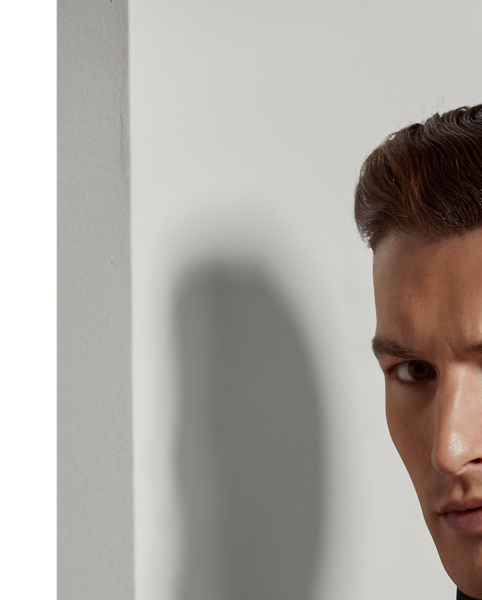 Made in Italy, this roll neck jumper represents the pinnacle of sophisticated minimalism with its ultra-fine rib-knit texture and sumptuous wool composition. The clean-lined, timeless silhouette and exceptional craftsmanship reflect Purple Label's commitment to creating elevated essentials.