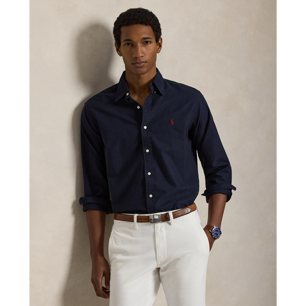 The oxford shirt made its debut very early in Ralph Lauren Lauren’s designs, and since then, it has solidified its status as a pillar of the Polo look. Our fabric is developed with a secret wash, which gives it instant character, ease and a heathered softness. The formula is so unique that it's been kept in a safe for more than three decades. In addition to details evoking its prep-school inspiration, it offers a relaxed feel, producing what we refer to as "the perfect rumple." Today, Mr Lauren continues to create countless variations of his iconic shirt, including this garment-dyed version, which is finished with our signature embroidered Pony.