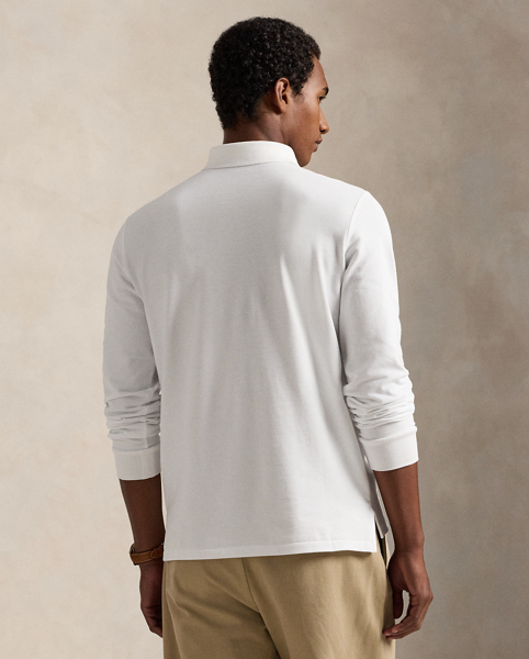 An American style standard since 1972, the Polo shirt has been imitated but never matched. Over the decades, Ralph Lauren Lauren has re-imagined his signature style in a wide array of colours and fits, yet all retain the quality and attention to detail of the iconic original. This trim version is made from our highly breathable cotton mesh, which offers a textured look and a soft feel.