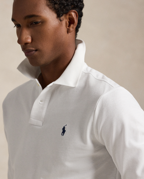 An American style standard since 1972, the Polo shirt has been imitated but never matched. Over the decades, Ralph Lauren Lauren has re-imagined his signature style in a wide array of colours and fits, yet all retain the quality and attention to detail of the iconic original. This trim version is made from our highly breathable cotton mesh, which offers a textured look and a soft feel.