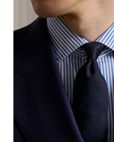 The double-breasted blazer is a staple of Mr Lauren's personal wardrobe, and this Purple Label version pays homage to the iconic silhouette. Immaculately tailored by hand in Italy with custom-developed wool serge, this blazer is defined by meticulously shaped shoulders that offer a raised, roped profile at the seam.