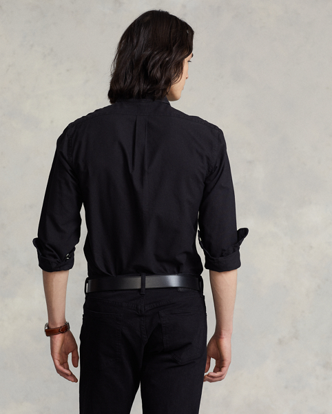 The oxford shirt made its debut very early in Ralph Lauren Lauren’s designs, and since then, it has solidified its status as a pillar of the Polo look. Our fabric is developed with a secret wash, which gives it instant character, ease and a heathered softness. The formula is so unique that it's been kept in a safe for more than three decades. In addition to details evoking its prep-school inspiration, it offers a relaxed feel, producing what we refer to as "the perfect rumple." Today, Mr Lauren continues to create countless variations of his iconic shirt, including this garment-dyed version, which is finished with our signature embroidered Pony.