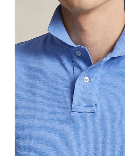An American style standard since 1972, the Polo shirt has been imitated but never matched. Over the decades,  Ralph Lauren Lauren has re-imagined his signature style in a wide array of colours and fits, yet all retain the quality and attention to detail of the iconic original. This trim version is made from our highly breathable cotton mesh, which offers a textured look and a soft feel.