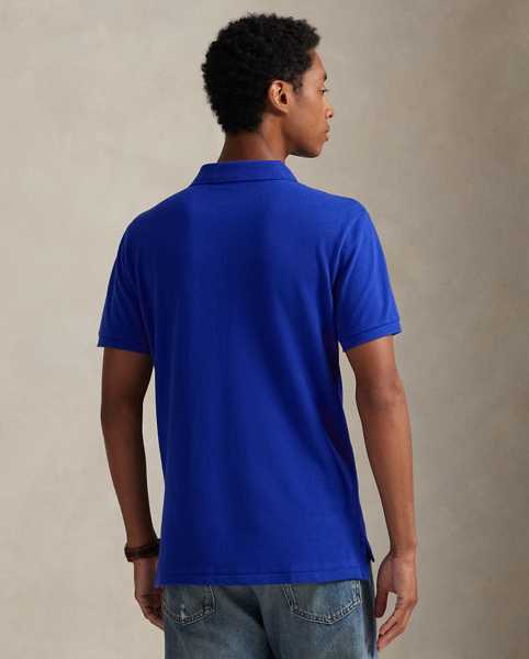 An American style standard since 1972, the Polo shirt has been imitated but never matched. Over the decades, Ralph Lauren Lauren has re-imagined his signature style in a wide array of colours and fits, yet all retain the quality and attention to detail of the iconic original. This trim version is made from our highly breathable cotton mesh, which offers a textured look and a soft feel.