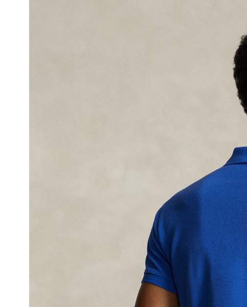 An American style standard since 1972, the Polo shirt has been imitated but never matched. Over the decades,  Ralph Lauren Lauren has re-imagined his signature style in a wide array of colours and fits, yet all retain the quality and attention to detail of the iconic original. This trim version is made from our highly breathable cotton mesh, which offers a textured look and a soft feel.