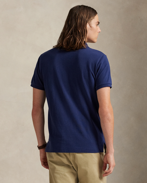 An American style standard since 1972, the Polo shirt has been imitated but never matched. Over the decades, Ralph Lauren Lauren has re-imagined his signature style in a wide array of colours and fits, yet all retain the quality and attention to detail of the iconic original. This trim version is made from our highly breathable cotton mesh, which offers a textured look and a soft feel.