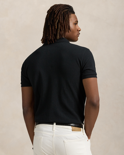 An American style standard since 1972, the Polo shirt has been imitated but never matched. Over the decades, Ralph Lauren Lauren has re-imagined his signature style in a wide array of colours and fits, yet all retain the quality and attention to detail of the iconic original. This trim version is made from our highly breathable cotton mesh, which offers a textured look and a soft feel.