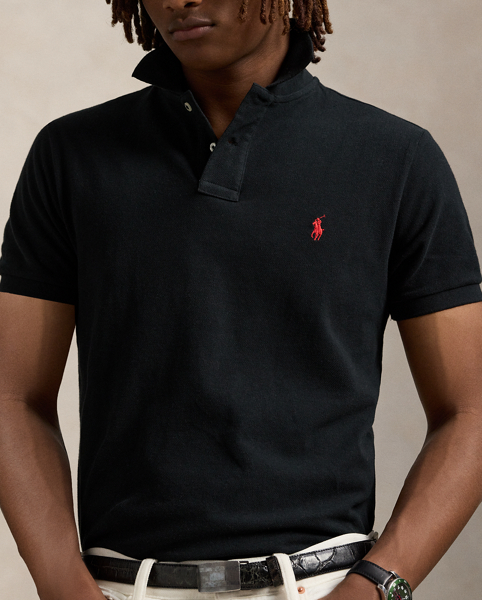 An American style standard since 1972, the Polo shirt has been imitated but never matched. Over the decades, Ralph Lauren Lauren has re-imagined his signature style in a wide array of colours and fits, yet all retain the quality and attention to detail of the iconic original. This trim version is made from our highly breathable cotton mesh, which offers a textured look and a soft feel.