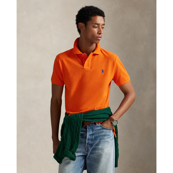 An American style standard since 1972, the Polo shirt has been imitated but never matched. Over the decades, Ralph Lauren Lauren has re-imagined his signature style in a wide array of colours and fits, yet all retain the quality and attention to detail of the iconic original. This trim version is made from our highly breathable cotton mesh, which offers a textured look and a soft feel.
