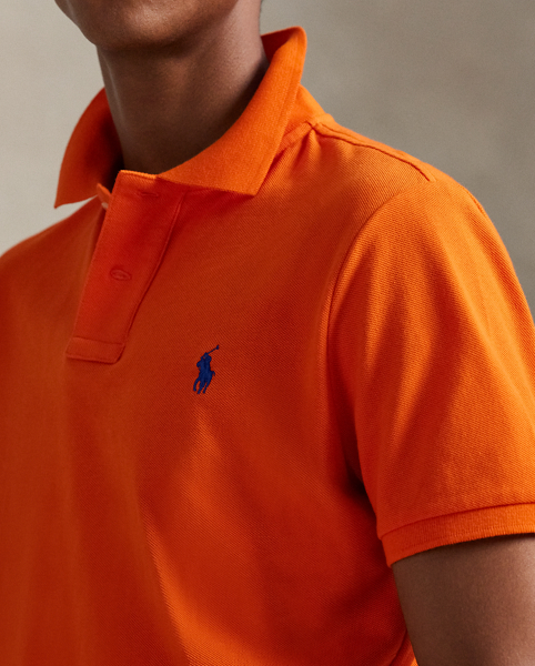 An American style standard since 1972, the Polo shirt has been imitated but never matched. Over the decades, Ralph Lauren Lauren has re-imagined his signature style in a wide array of colours and fits, yet all retain the quality and attention to detail of the iconic original. This trim version is made from our highly breathable cotton mesh, which offers a textured look and a soft feel.