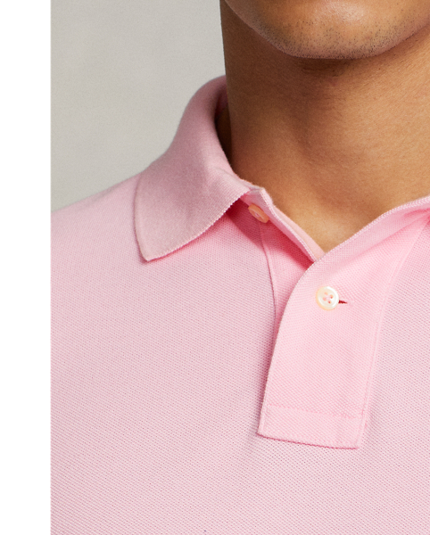 An American style standard since 1972, the Polo shirt has been imitated but never matched. Over the decades,  Ralph Lauren Lauren has re-imagined his signature style in a wide array of colours and fits, yet all retain the quality and attention to detail of the iconic original. This trim version is made from our highly breathable cotton mesh, which offers a textured look and a soft feel.