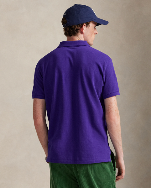 An American style standard since 1972, the Polo shirt has been imitated but never matched. Over the decades, Ralph Lauren Lauren has re-imagined his signature style in a wide array of colours and fits, yet all retain the quality and attention to detail of the iconic original. This trim version is made from our highly breathable cotton mesh, which offers a textured look and a soft feel.