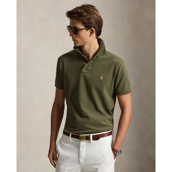 An American style standard since 1972, the Polo shirt has been imitated but never matched. Over the decades,  Ralph Lauren Lauren has re-imagined his signature style in a wide array of colours and fits, yet all retain the quality and attention to detail of the iconic original. This trim version is made from our highly breathable cotton mesh, which offers a textured look and a soft feel.