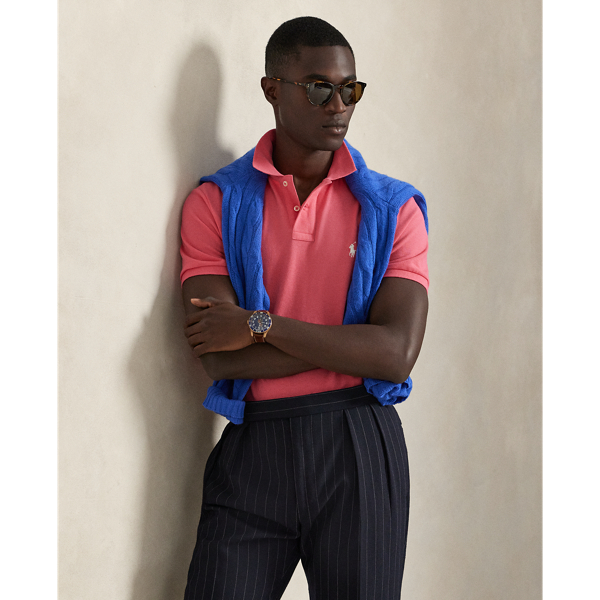 An American style standard since 1972, the Polo shirt has been imitated but never matched. Over the decades, Ralph Lauren Lauren has re-imagined his signature style in a wide array of colours and fits, yet all retain the quality and attention to detail of the iconic original. This trim version is made from our highly breathable cotton mesh, which offers a textured look and a soft feel.