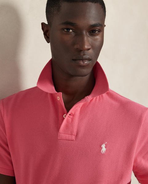 An American style standard since 1972, the Polo shirt has been imitated but never matched. Over the decades, Ralph Lauren Lauren has re-imagined his signature style in a wide array of colours and fits, yet all retain the quality and attention to detail of the iconic original. This trim version is made from our highly breathable cotton mesh, which offers a textured look and a soft feel.