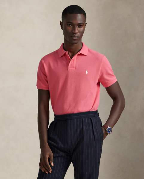 An American style standard since 1972, the Polo shirt has been imitated but never matched. Over the decades, Ralph Lauren Lauren has re-imagined his signature style in a wide array of colours and fits, yet all retain the quality and attention to detail of the iconic original. This trim version is made from our highly breathable cotton mesh, which offers a textured look and a soft feel.