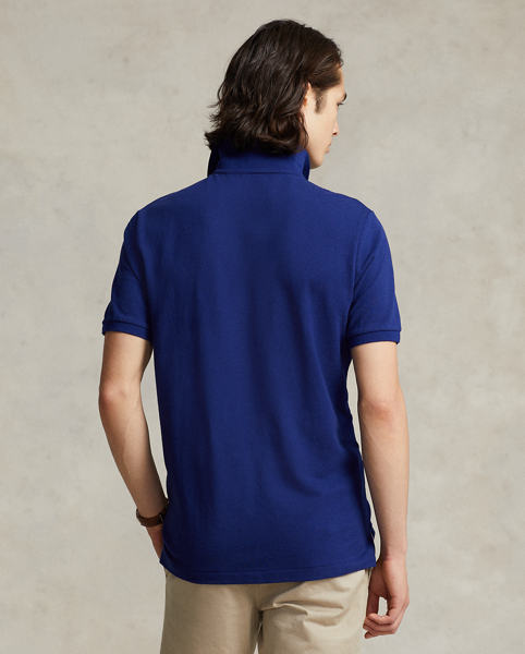 An American style standard since 1972, the Polo shirt has been imitated but never matched. Over the decades, Ralph Lauren Lauren has re-imagined his signature style in a wide array of colours and fits, yet all retain the quality and attention to detail of the iconic original. This trim version is made from our highly breathable cotton mesh, which offers a textured look and a soft feel.