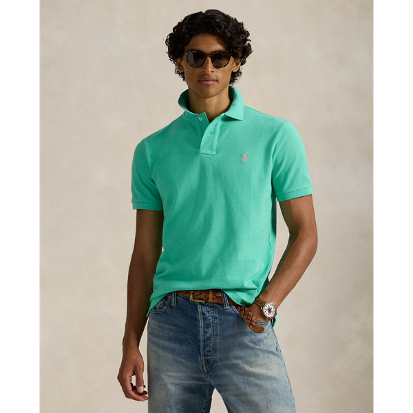 An American style standard since 1972, the Polo shirt has been imitated but never matched. Over the decades,  Ralph Lauren Lauren has re-imagined his signature style in a wide array of colours and fits, yet all retain the quality and attention to detail of the iconic original. This trim version is made from our highly breathable cotton mesh, which offers a textured look and a soft feel.