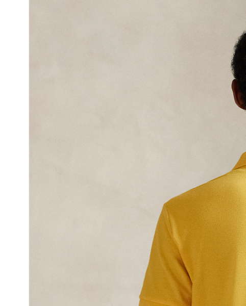 An American style standard since 1972, the Polo shirt has been imitated but never matched. Over the decades,  Ralph Lauren Lauren has re-imagined his signature style in a wide array of colours and fits, yet all retain the quality and attention to detail of the iconic original. This trim version is made from our highly breathable cotton mesh, which offers a textured look and a soft feel.