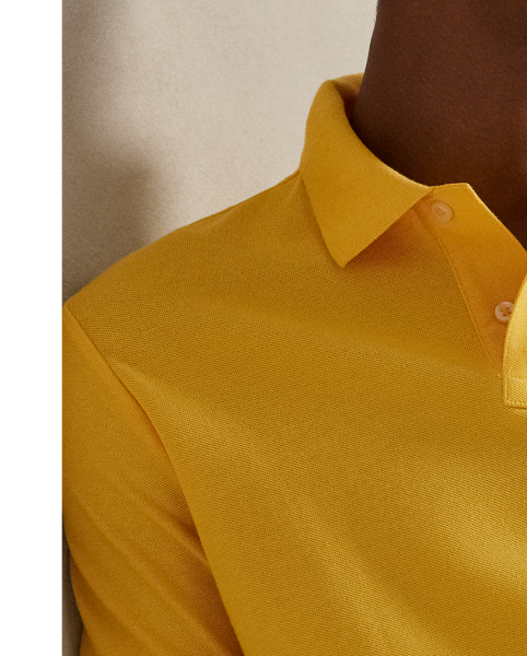 An American style standard since 1972, the Polo shirt has been imitated but never matched. Over the decades,  Ralph Lauren Lauren has re-imagined his signature style in a wide array of colours and fits, yet all retain the quality and attention to detail of the iconic original. This trim version is made from our highly breathable cotton mesh, which offers a textured look and a soft feel.