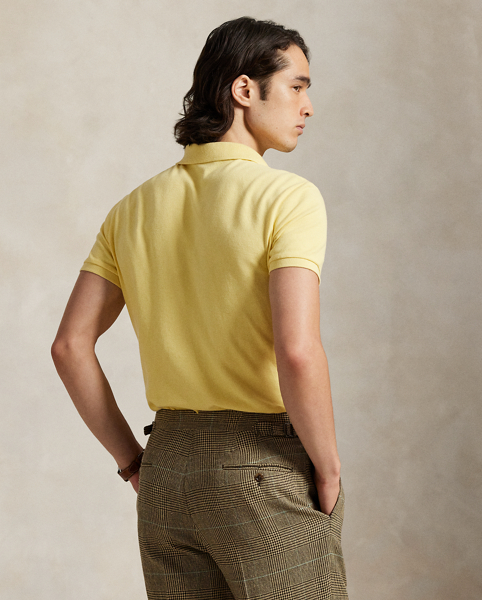An American style standard since 1972, the Polo shirt has been imitated but never matched. Over the decades, Ralph Lauren Lauren has re-imagined his signature style in a wide array of colours and fits, yet all retain the quality and attention to detail of the iconic original. This trim version is made from our highly breathable cotton mesh, which offers a textured look and a soft feel.