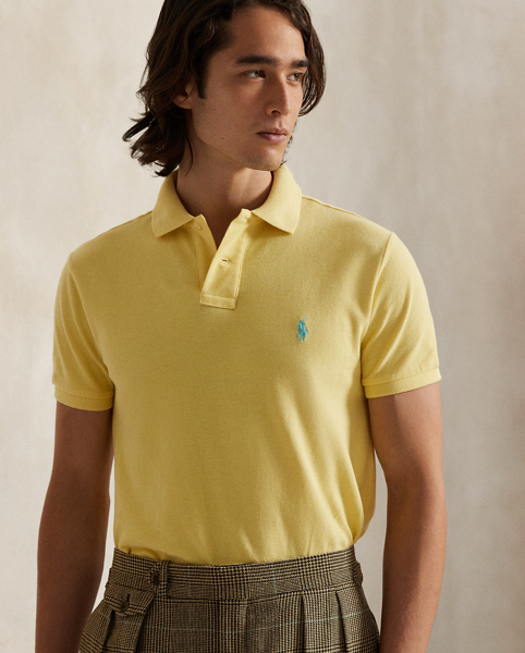 An American style standard since 1972, the Polo shirt has been imitated but never matched. Over the decades, Ralph Lauren Lauren has re-imagined his signature style in a wide array of colours and fits, yet all retain the quality and attention to detail of the iconic original. This trim version is made from our highly breathable cotton mesh, which offers a textured look and a soft feel.