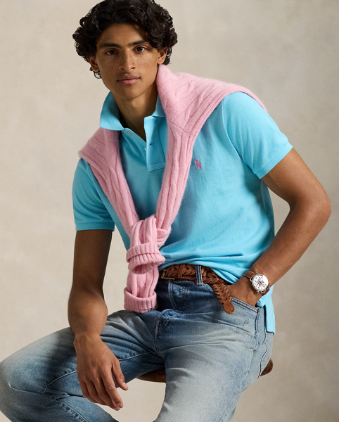 An American style standard since 1972, the Polo shirt has been imitated but never matched. Over the decades, Ralph Lauren Lauren has re-imagined his signature style in a wide array of colours and fits, yet all retain the quality and attention to detail of the iconic original. This trim version is made from our highly breathable cotton mesh, which offers a textured look and a soft feel.