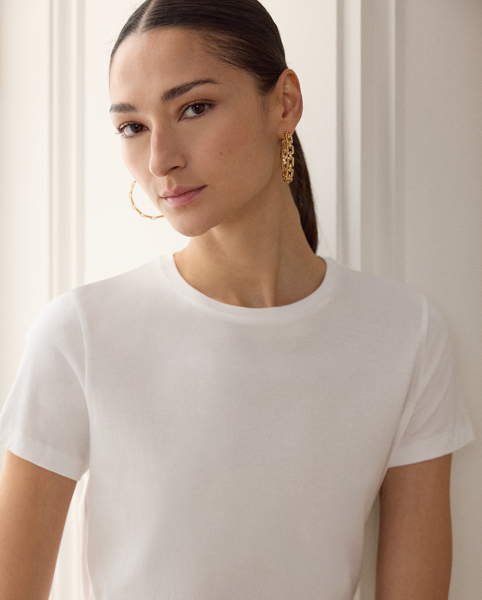 Ralph Lauren Lauren's luxurious take on the essential T-shirt is crafted from cotton, which is singed and gassed in its raw form to create a clean, lustrous hand, and finished with our script " Ralph Lauren Lauren" embroidery.