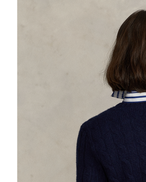 Inspired by fishermen's ropes, the cable-knit jumper's defining motif has transformed from a practical, hard-wearing construction into a symbol of collegiate style. This version is crafted from luxuriously soft cashmere, which is spun and dyed in a renowned Italian mill.