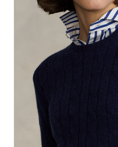 Inspired by fishermen's ropes, the cable-knit jumper's defining motif has transformed from a practical, hard-wearing construction into a symbol of collegiate style. This version is crafted from luxuriously soft cashmere, which is spun and dyed in a renowned Italian mill.