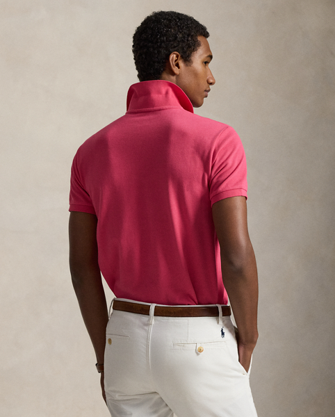 An American style standard since 1972, the Polo shirt has been imitated but never matched. Over the decades, Ralph Lauren Lauren has re-imagined his signature style in a wide array of colours and fits, yet all retain the quality and attention to detail of the iconic original. This version is cut slim through the body and washed for added softness.