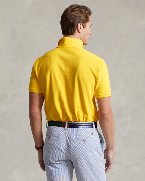 An American style standard since 1972, the Polo shirt has been imitated but never matched. Over the decades, Ralph Lauren Lauren has re-imagined his signature style in a wide array of colours and fits, yet all retain the quality and attention to detail of the iconic original. This version is cut slim through the body and washed for added softness.