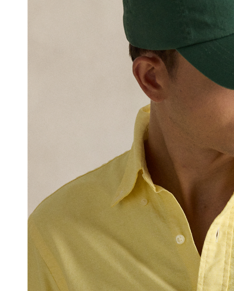 The oxford shirt made its debut very early in  Ralph Lauren Lauren’s designs, and since then, it has solidified its status as a pillar of the Polo look. Our fabric is developed with a secret wash, giving it instant character, ease and a heathered softness – what we refer to as "the perfect rumple". The formula is so unique that it's been kept in a safe for more than three decades. Today, Mr Lauren continues to create countless variations of his iconic shirt, including this Custom Fit version, which is embroidered with our multicoloured signature Pony.