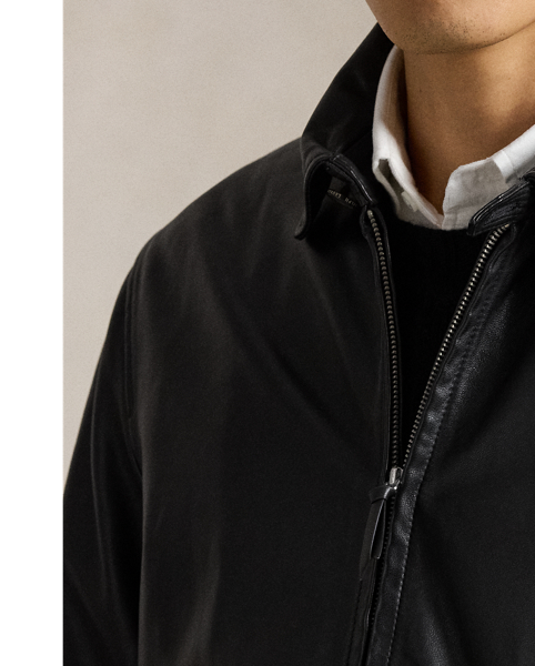 This jacket combines the sporty silhouette of a windbreaker with supple full-grain leather. Plaid lining gives it a heritage-inspired touch.