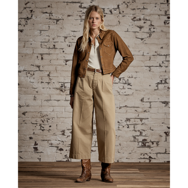 Inspired by 1940s trousers. Made from Japanese piece-dyed cotton twill. Hand-set back flapped pockets. Stitched-down pleated front. Buttoned belt loops and adjustable tabs on the sides. Stonewashed.
