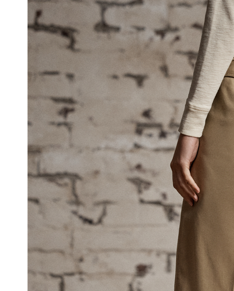 Inspired by 1940s trousers. Made from Japanese piece-dyed cotton twill. Hand-set back flapped pockets. Stitched-down pleated front. Buttoned belt loops and adjustable tabs on the sides. Stonewashed.