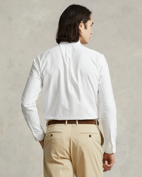 The oxford shirt made its debut very early in Ralph Lauren Lauren’s designs, and since then, it has solidified its status as a pillar of the Polo look. Our fabric is developed with a secret wash, which gives it instant character, ease and a heathered softness. The formula is so unique that it's been kept in a safe for more than three decades. In addition to details evoking its prep-school inspiration, it offers a relaxed feel, producing what we refer to as "the perfect rumple". Today, Mr Lauren continues to create countless variations of his iconic shirt, including this version, which is finished with our signature embroidered Pony.