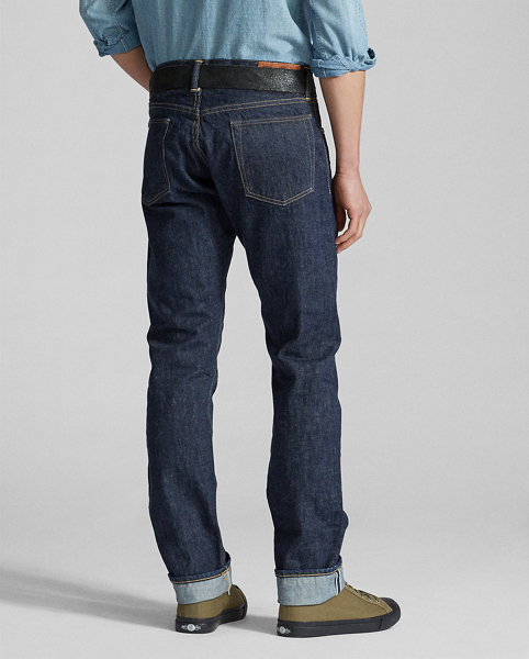 Slim-fitting jeans made in America from 13.75 oz. selvedge denim that is shuttle-woven in Japan. Cotton yarns are ring-spun and rope-dyed to achieve Double RL's deepest indigo shade with an authentic red-blue cast. Right-hand twill is custom-developed to create a "grin-through" effect in which the lighter-hued weft yarns are visible on the face of the cloth. Rinsed and specially treated for a soft, sun-dried effect. Sanforized to minimise shrinkage.