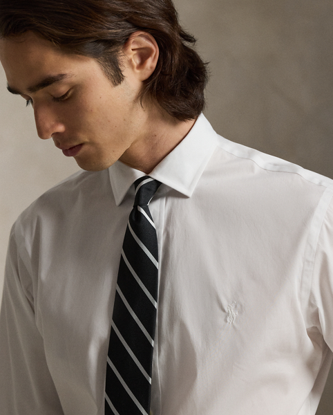 A multi-step process that includes high-tension yarn-spinning gives this shirt's pure cotton fabric a hint of stretch.