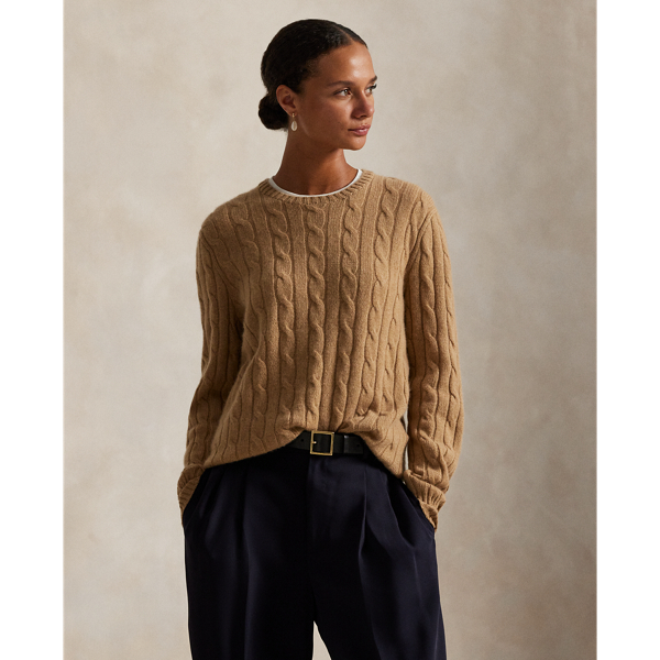 Inspired by fishermen's ropes, the cable-knit jumper's defining motif has transformed from a practical, hard-wearing construction into a symbol of collegiate style. This version is crafted from luxuriously soft cashmere, which is spun and dyed in a renowned Italian mill.