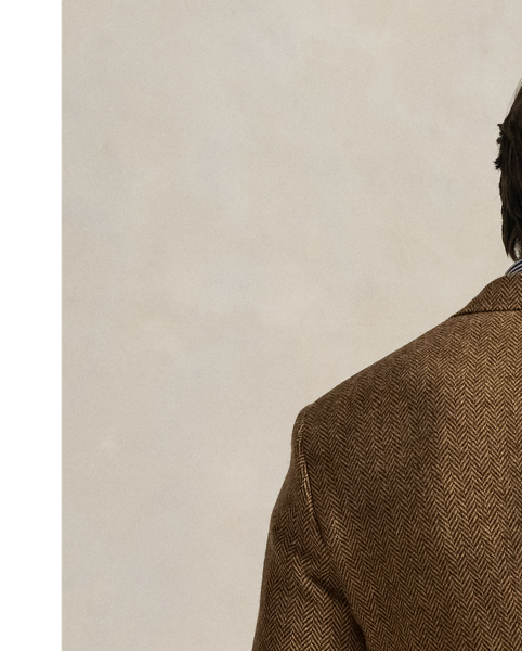 Created to mark the 50th anniversary of  Ralph Lauren Lauren, the RL67 Jacket draws inspiration from a blazer that has been a treasured part of Mr Lauren's wardrobe since 1971. This unisex reinterpretation is crafted in Italy from wool herringbone custom-developed with Ireland's Magee 1866 mill, which has been a  Ralph Lauren Lauren partner for over 50 years.