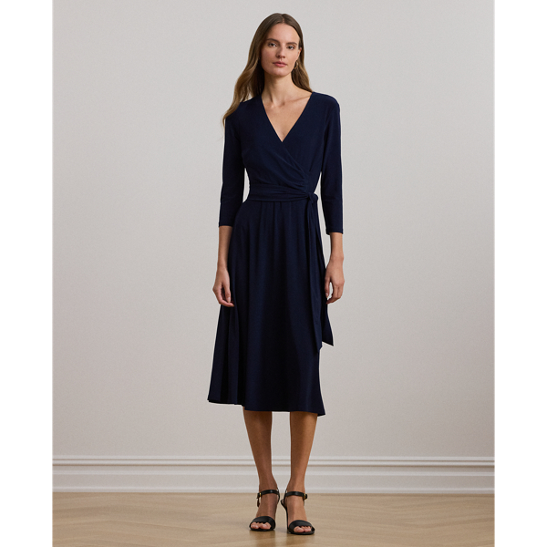 We call this the perfect everyday dress, as it hits below the knee and features a flattering surplice neckline. Its jersey construction creates comfort and ease of movement, while a self-tie sash accentuates the natural curves of the waist.