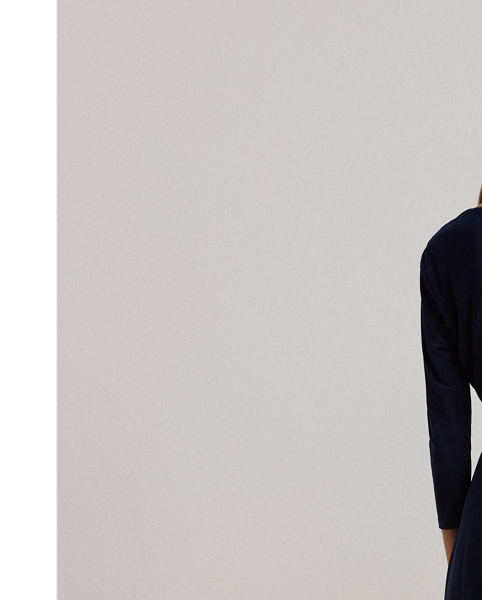 We call this the perfect everyday dress, as it hits below the knee and features a flattering surplice neckline. Its jersey construction creates comfort and ease of movement, while a self-tie sash accentuates the natural curves of the waist.