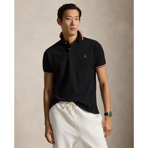 An American style standard since 1972, the Polo shirt has been imitated but never matched. Over the decades, Ralph Lauren Lauren has re-imagined his signature style in a wide array of colours and fits, yet all retain the quality and attention to detail of the iconic original. This trim version is made from our highly breathable cotton mesh, which offers a textured look and a soft feel.