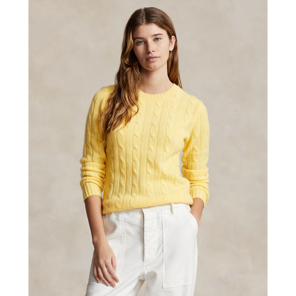 Inspired by fishermen's ropes, the cable-knit jumper's defining motif has transformed from a practical, hard-wearing construction into a symbol of collegiate style. This version is crafted from luxuriously soft cashmere, which is spun and dyed in a renowned Italian mill.